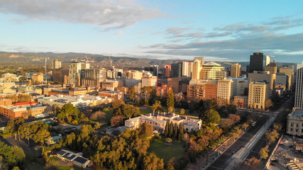 Naklejka premium ADELAIDE, AUSTRALIA - SEPTEMBER 16, 2018: Aerial view of city skyline at sunset. Adelaide is the main city of South Australia State