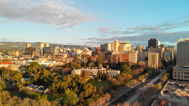 ADELAIDE, AUSTRALIA - SEPTEMBER 16, 2018: Aerial view of city skyline at sunset. Adelaide is the main city of South Australia State