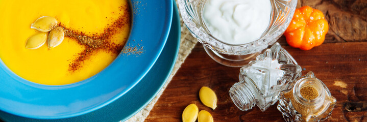 Pumpkin soup served in a hollowed pumpkins