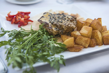 Closeup of beef fillet steak in pepper sauce meal