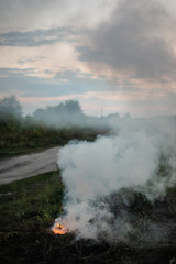 Smoke of a fading fire on the street. For use as a texture