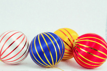 three christmas balls on white