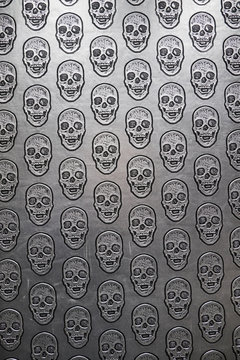 Pattern of skulls on gray surface