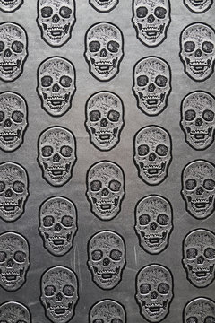 Pattern of skulls on gray surface