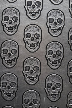 Pattern of skulls on gray surface