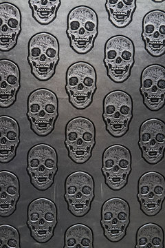 Pattern of skulls on gray surface