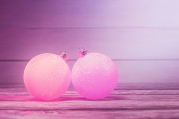 Two violet Christmas tree balls.