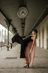 Pretty young girl posing at train station