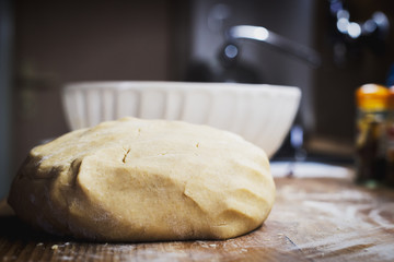 Christmas baking. Making gingerbread biscuits. Cookie dough on kitchen counter.