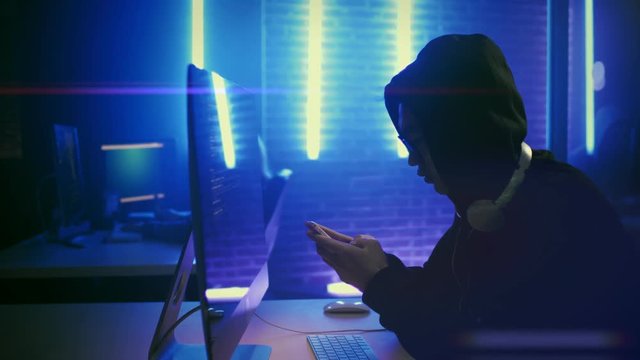 Young hacker chatting with his customer