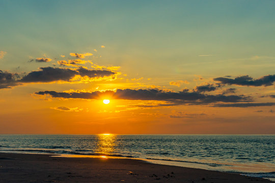 Sunset on the beach on north side of the Provincelands Cape Cod, Atlantic ocean view MA US.