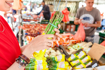 People buying fruits and vegetables At Outdoor Farmers Market