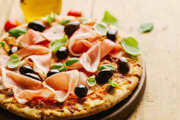 Italian pizza on wooden table
