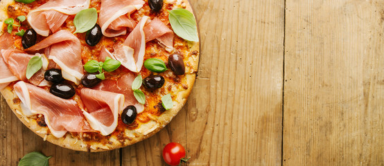 Italian pizza on wooden table