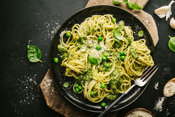 Tasty pasta with pesto served on plate