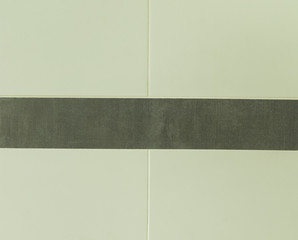 Light  tiles separated in the middle by dark tiles as texture background surface for design and...