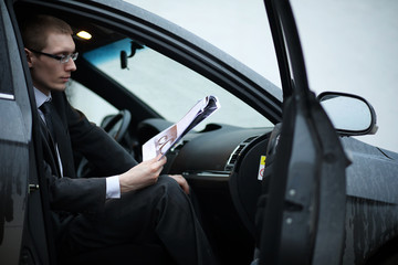 Man in a business suit in the car