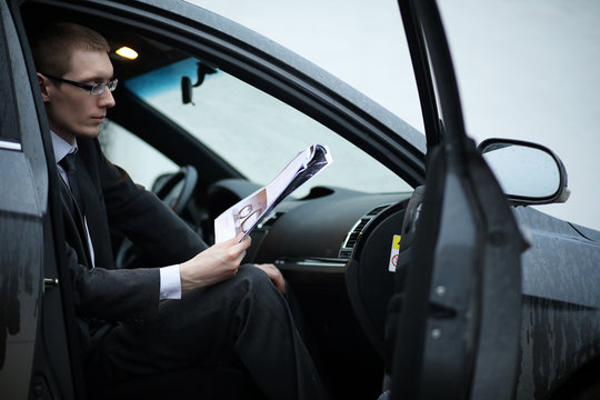 Man in a business suit in the car