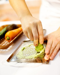 Sushi chef grating fresh Wasabi, Fresh wasabi root prepare for nigiri sushi