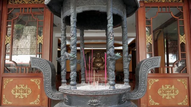 Buddhist prayer sticks burining in chinese temple.