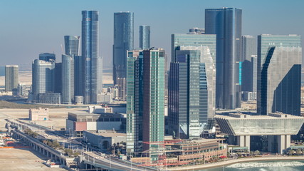 Aerial skyline of Abu Dhabi city centre from above timelapse