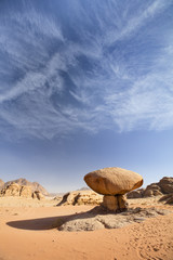 Fototapeta na wymiar view to huge flat stone in desert under blue sky