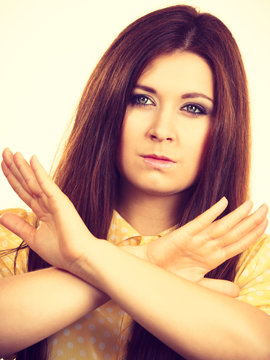 Assertive woman showing stop gesture