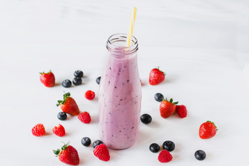 Berry smoothie on white background