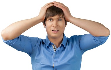 Shocked Young Man with Hands on Head - Isolated