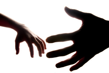 Isolated men and children hands reach toward each other