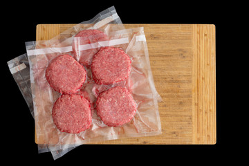 Isolated beef burger patties prepared for freezing