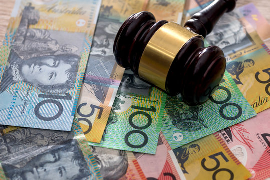 Judge's gavel on australian dollars, justice concept