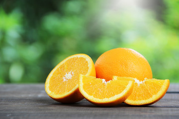 Fresh oranges fruit slice on wooden table.