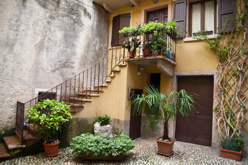 Small town narrow street view with colorful houses in Malcesine