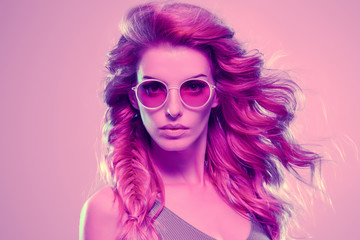 Fashion neon light. Girl with glowing Hairstyle