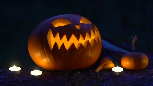 Halloween pumpkin with burning candles