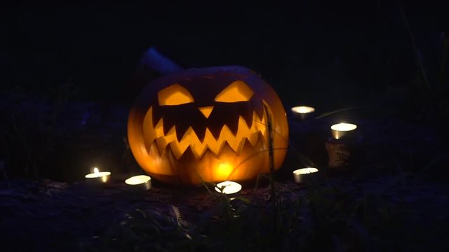 Halloween pumpkin with burning candles