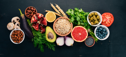 Healthy food clean eating selection: Vegetables, fruits, nuts, berries and mushrooms, parsley,...