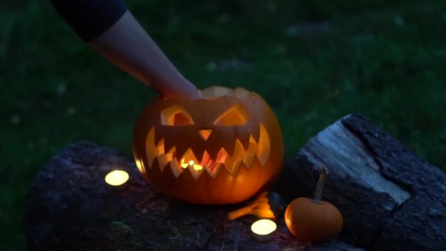 Halloween pumpkin with burning candles