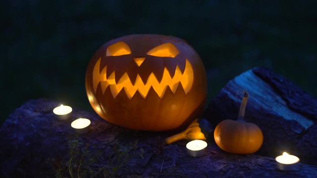 Halloween pumpkin with burning candles