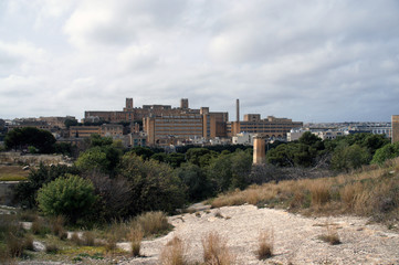 Fototapeta na wymiar St. Luke's Hospital in Pieta, Malta, as visible from fortifications of Floriana