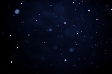 Snowfall on black background - design element. Abstract black white snow texture on black background for overlay