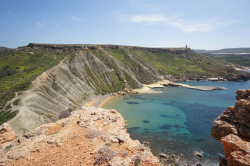 Rocks and panorama of Gnejna Bay, Golden Bay, Malta