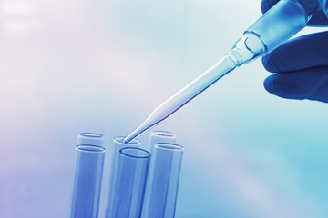 Medical scientist working with laboratory glassware
