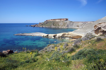 Fototapeta na wymiar Rocky cliffs of Gnejna Bay from Ta'Lippija, Golden Bay, Malta