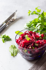 Healthy vegan beetroot salad with nuts and herbs. 
