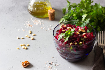 Healthy vegan beetroot salad with nuts and herbs. 