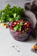 Healthy vegan beetroot salad with nuts and herbs. 