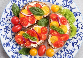 Sandwiches with cheese and tomatoes.