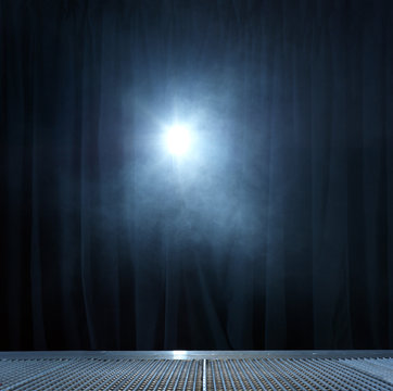 Spotlight shining on curtain